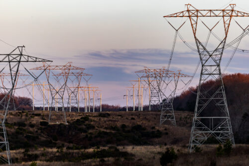 An image of high tension power lines stretching across a Maryland landscape at dusk.